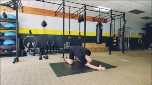 How to do Quadruped Crossover Lat Stretch. 1 of over 100 exercises in our FREE Exercise Library by USMC Veteran & Personal Trainer Marine Miguel.