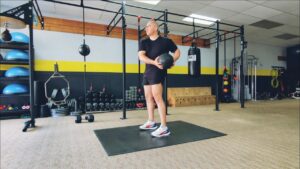 How to do Standing Medicine Ball Russian Twists. 1 of over 100 exercises in our FREE Exercise Library by USMC Veteran & Personal Trainer Marine Miguel.