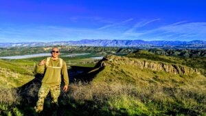 Marine Miguel hiking in boots & utes beautiful view of Thousand Oaks hills & trails